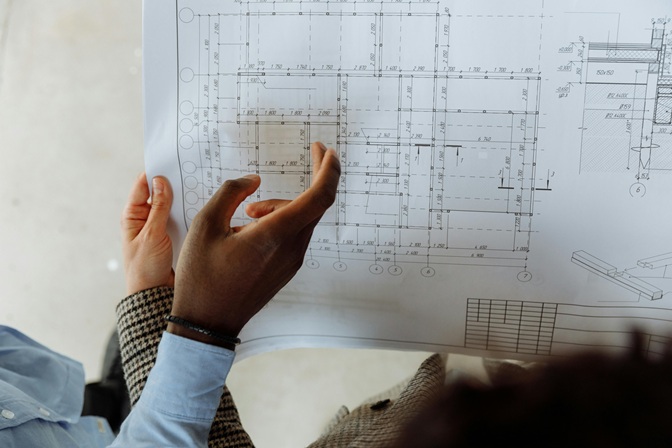 Construction professionals reviewing architectural plans